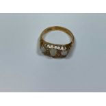 An Edwardian 18ct yellow gold opal and diamond ring, Birmingham 1908, size n 1/2, 3.5g