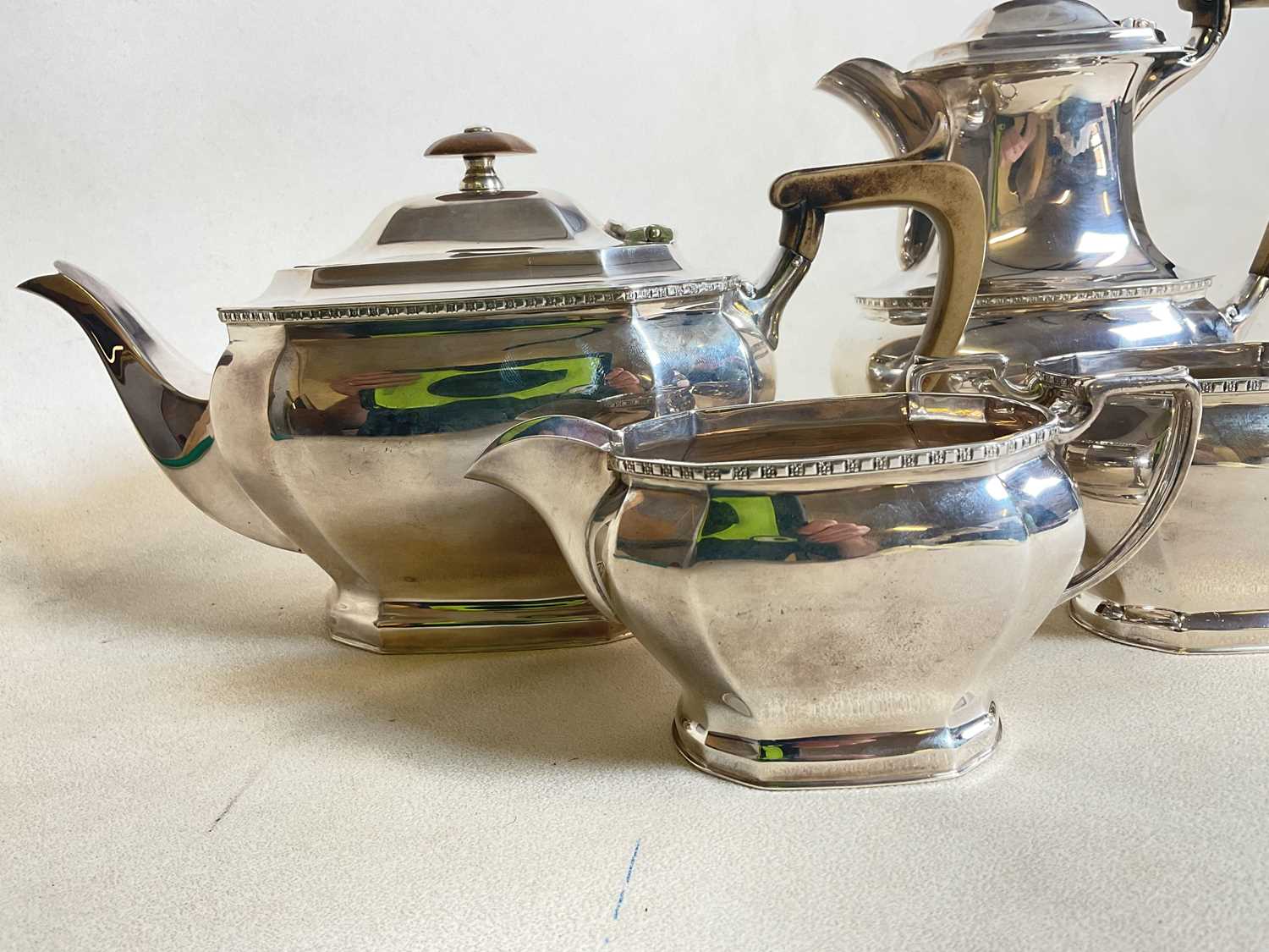 COOPER BROS AND SONS; a hallmarked silver four piece tea set comprising teapot, water jug, sugar - Image 13 of 17