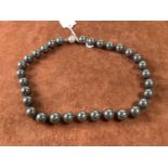 A hand tied haematite bead necklace, length 47cm.