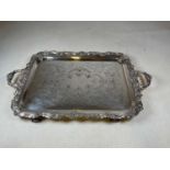 A good and large silver plated and white metal applied twin handled tray with engraved scroll