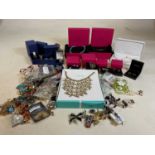 A collection of costume jewellery including boxed Swarovski items, Pia boxed items and others