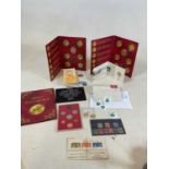 A collection of coins and stamps including The Coinage of Great Britain and Northern Ireland 1982,