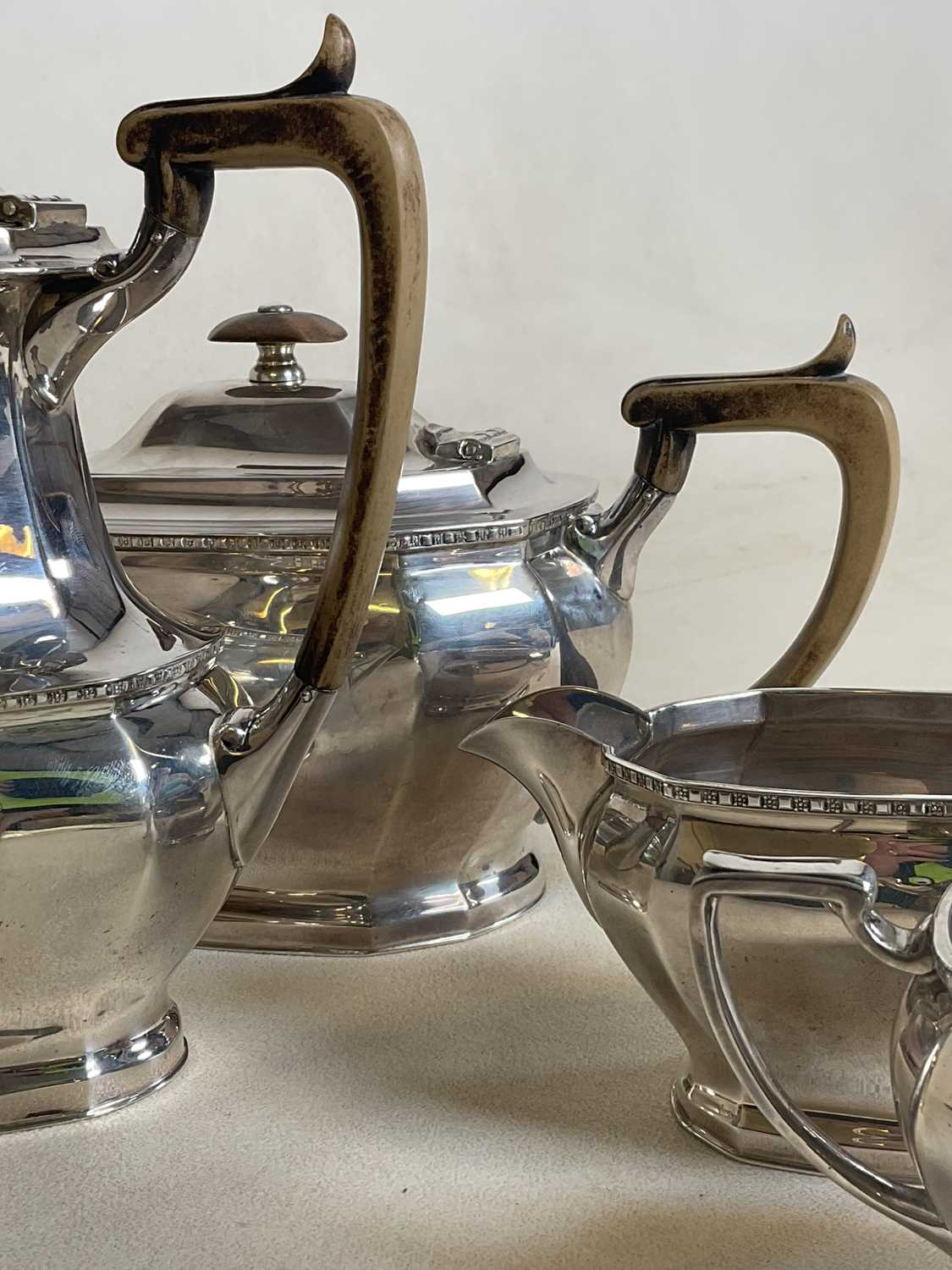 COOPER BROS AND SONS; a hallmarked silver four piece tea set comprising teapot, water jug, sugar - Image 2 of 17