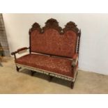 A Gothic style carved oak three seat banquette sofa with barley twist features,height 150cm, width