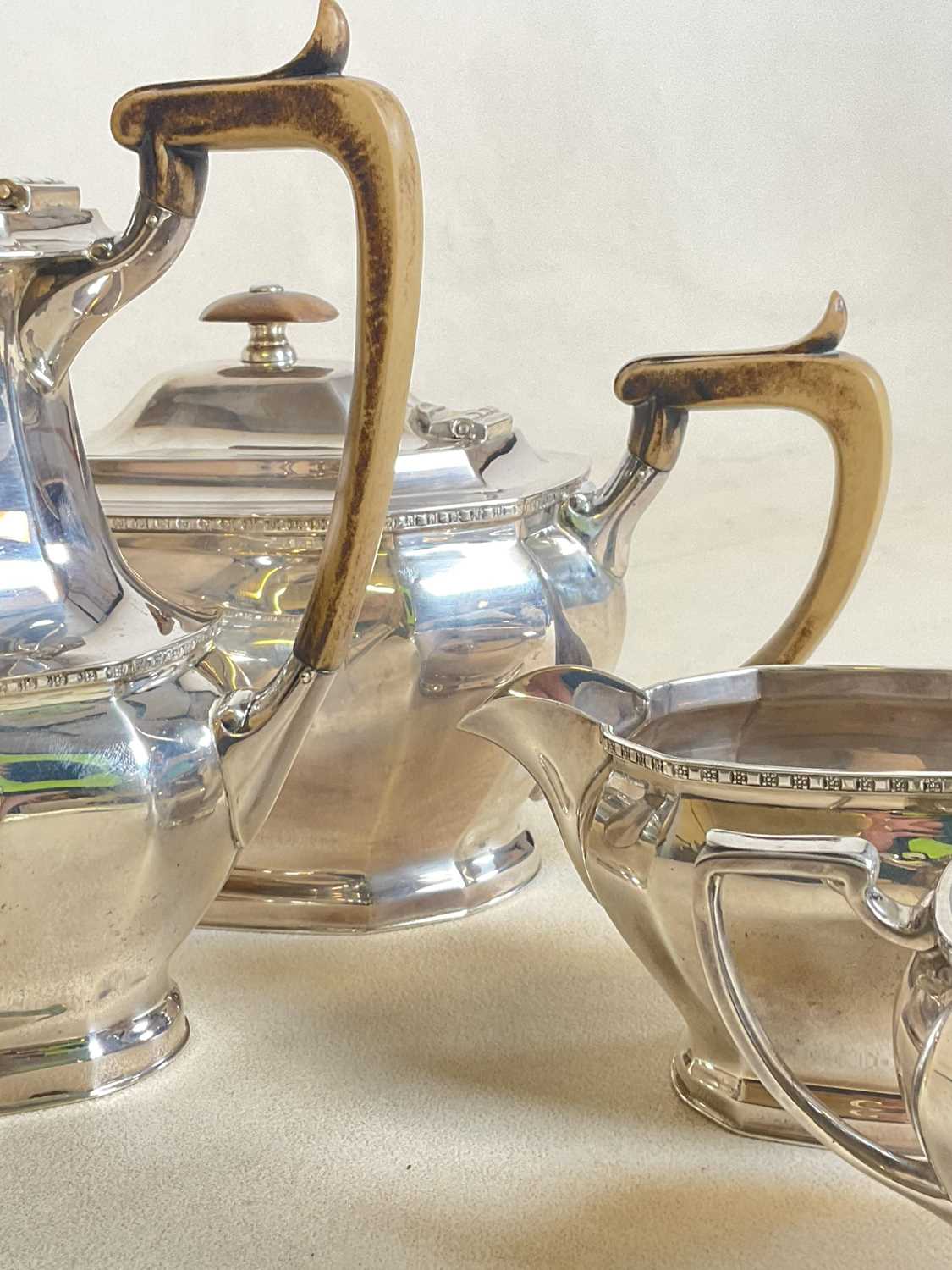 COOPER BROS AND SONS; a hallmarked silver four piece tea set comprising teapot, water jug, sugar - Image 10 of 17