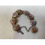 An early 20th century white metal Satsuma ware bracelet with eight roundels