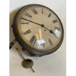 A 19th century circular 12 inch wall clock with fusee movement and pendulum with key .