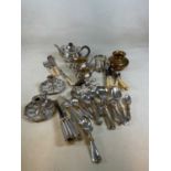 A collection of silver plated items and cutlery and flatware to include a pair of chamber
