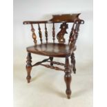 A late 19th/early 20th century smoker's bow/captain's armchair with elm seat, seat height 45cm,