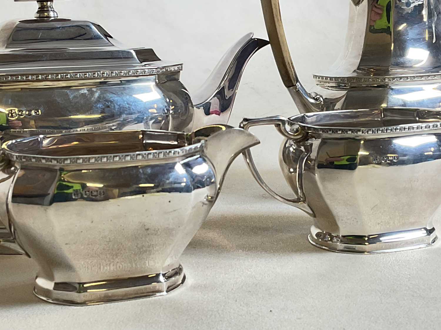 COOPER BROS AND SONS; a hallmarked silver four piece tea set comprising teapot, water jug, sugar - Image 14 of 17