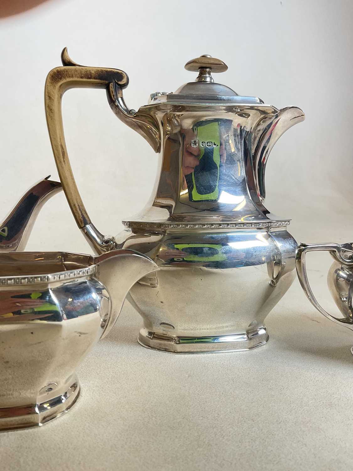 COOPER BROS AND SONS; a hallmarked silver four piece tea set comprising teapot, water jug, sugar - Image 7 of 17