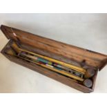 A pine cased vintage croquet set comprising 4 mallets, 4 balls, 2 pegs and various hoops, length