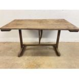 A French vintage wine maker's table, with tilt-top and folding stretcher support bar, height 69cm,