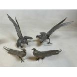 Two pairs of vintage white metal bird studies including a pair of pheasants and a pair of fighting