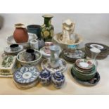 A large collection of ceramics including a jug and ewer set, a large quantity of plates, vases and