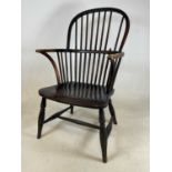An oak Windsor chair with one spindle broken, height 93cm, width 53cm, depth 50cm.
