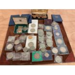 A collection of coins including silver wedding crowns, Churchill crowns, Britain's first decimal