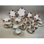 ROYAL ALBERT; a 'Country Roses' part dinner and tea service comprising over fifty pieces,