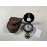 A WWII period leather cased pocket compass.