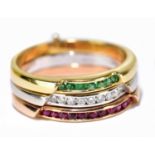 A set of three 18ct yellow gold rings forming the Italian flag, set with emeralds, diamonds and