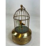 A 20th century brass bird cage automoton with yellow feathered bird (some feather losses) on