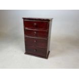 A small apprentice piece, painted pine chest of four graduated drawers, height 42cm, width 30cm,