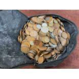 A large collection of coins, all loose, mainly British, within a bag.