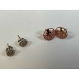 A pair of 9ct gold diamond stud earrings and a pair of rose gold coloured silver earrings marked