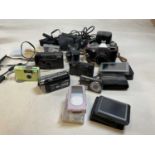 A collection of cameras, an I-pod and Garmin sat navs, including a Praktica LB 2, LUMIX, Nikon and
