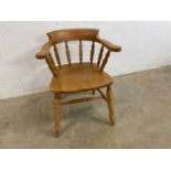 A beech wood smoker's bow armchair, overall height 76cm, width 64cm, seat height 46cm, depth 51cm.