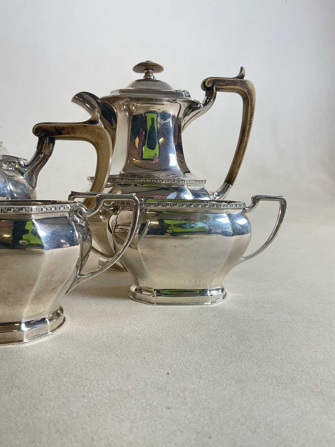 COOPER BROS AND SONS; a hallmarked silver four piece tea set comprising teapot, water jug, sugar - Image 16 of 17