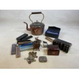 A wooden money box, a stationery desk organiser, a coin holder and coins, pens and other items