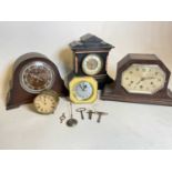 A slate mantel clock, wooden mantel clocks, a brass mantel clock etc, with various keys.