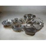A group of silver plate comprising a rose bowl, four swing handled baskets and a wine bottle