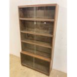 Minty; a sectional library bookcase, with five sections and sliding glass doors. (Sections not