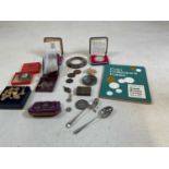 A mixed collectors' lot to include miscellaneous coins, two hallmarked silver silver spoons, an