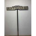 A tall wooden 'Antiques' painted sign on wrought iron post, height 210cm, width 140cm