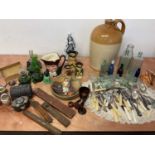 A large Bristol flagon, with Toby jugs, glass bottles, flat ware etc.