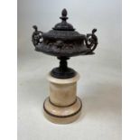 A neo-classical style urn with integral mable effect plinth, height 43cm, diameter 22cm.