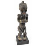A Fang reliquary figure, Gabon, applied with brass detail and on contemporary plinth stand, height
