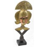 A Kota reliquary figure, Gabon, applied with copper and brass and on contemporary mount, height