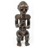 A Fang reliquary figure, Gabon, applied with brass detail, height 58cm.Provenance: This collection