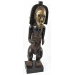 A Fang, Gabon, figure with brass applied face and basket work detail to the torso, presented on a