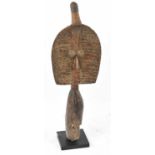 A Kota reliquary figure, Gabon, applied with copper and on contemporary mount, height 61cm.