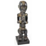 A Fang reliquary figure, Gabon, applied with brass detail and presented on a contemporary plinth