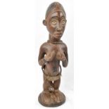 A Luba, Congo, figure with wrought iron and string attachments, height 53cm.Provenance: This