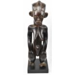 A Punu, Gabon, standing figure mounted on contemporary plinth, height 67.5cm.Provenance: This