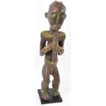 A Fang reliquary figure, Gabon, applied with brass detail and presented on contemporary plinth,