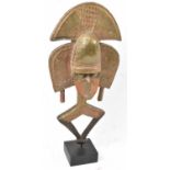 A Kota reliquary figure, Gabon, double faced and with applied with copper and brass, presented on