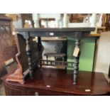 A Victorian ebonised fold over games table with inlaid top, width 90cm, depth 42cm, height 71cm.